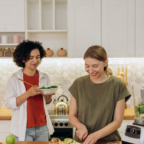 two women preparing healthy food